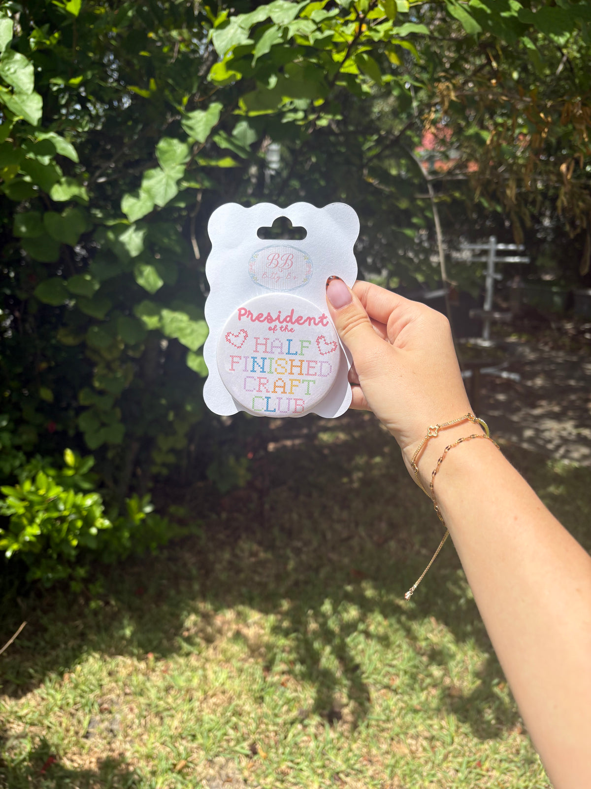 President of the half finished craft club button
